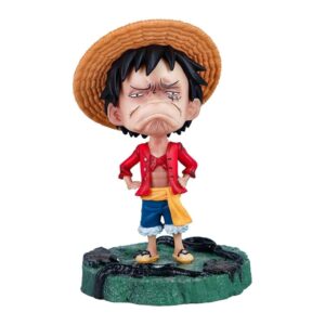 Figurine Luffy avec expression boudeur, révélant sa vulnérabilité émotionnelle